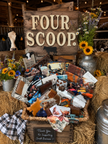 Display of various items with 'Four Scoop' sign in a rustic setting