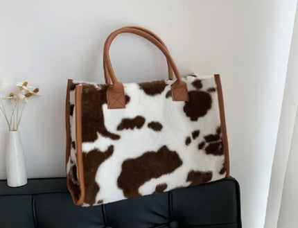 A brown and white plush tote