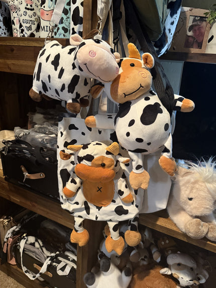 A mixture of plushy cow bags