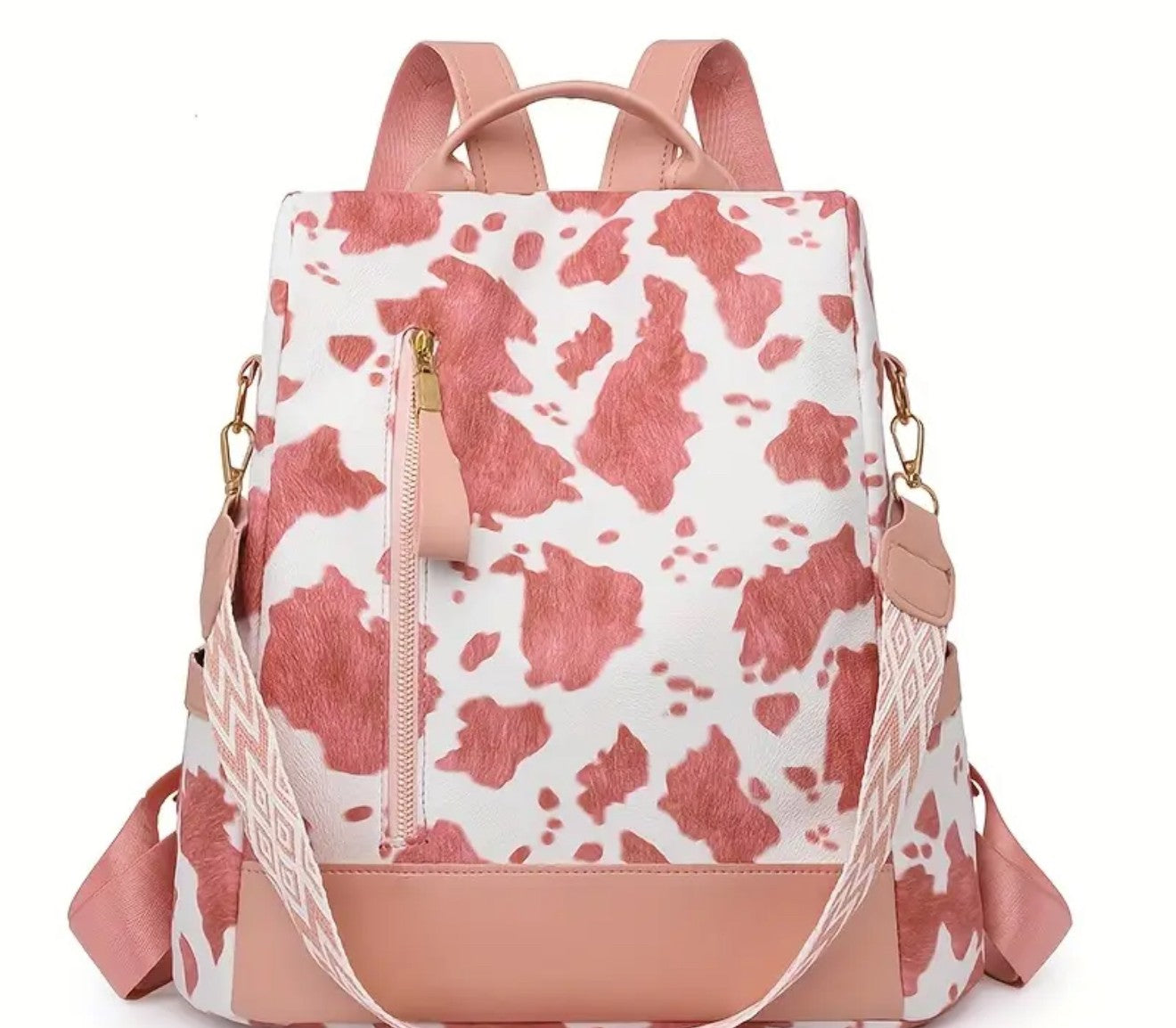 A pink and white cow print backpack