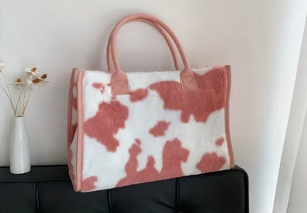 A pink and white plush tote